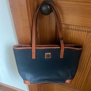 Brand new Dooney and Bourke bag in dark blue